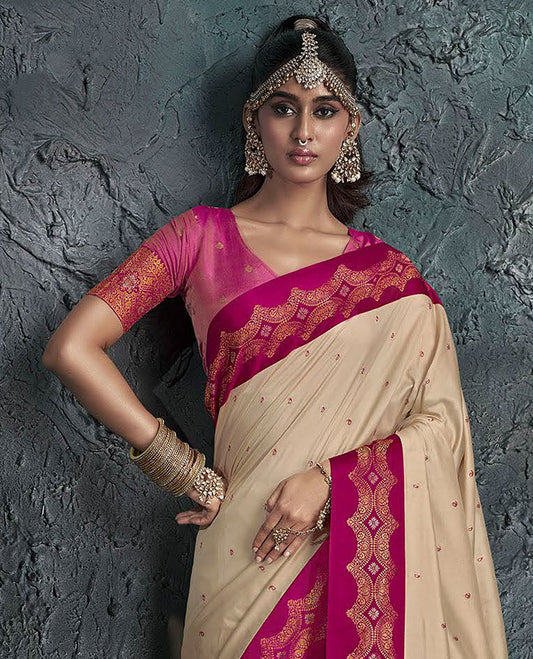 Sandal Designer Saree, Decked Up with Buttas on Its Body, Complemented by a Contrast Border of Intricate Motifs, Pallu of Intricate Zari Designs, and Paired with a Contrast Blouse