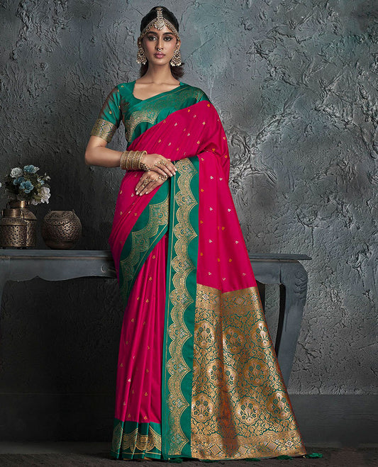 Red Designer Saree, Decked Up with Buttas on Its Body, Complemented by a Contrast Border of Intricate Motifs, Pallu of Mughal-Style Floral Zari Designs, and Paired with a Contrast Blouse