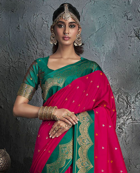 Red Designer Saree, Decked Up with Buttas on Its Body, Complemented by a Contrast Border of Intricate Motifs, Pallu of Mughal-Style Floral Zari Designs, and Paired with a Contrast Blouse