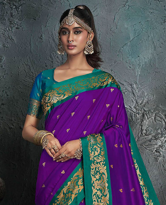 Violet Designer Saree, Bedecked with Buttas on Its Body, Complemented by a Contrast Border of Floral Designs, Pallu of Mughal-Style Intricate Zari Designs, and Paired with a Contrast Blouse