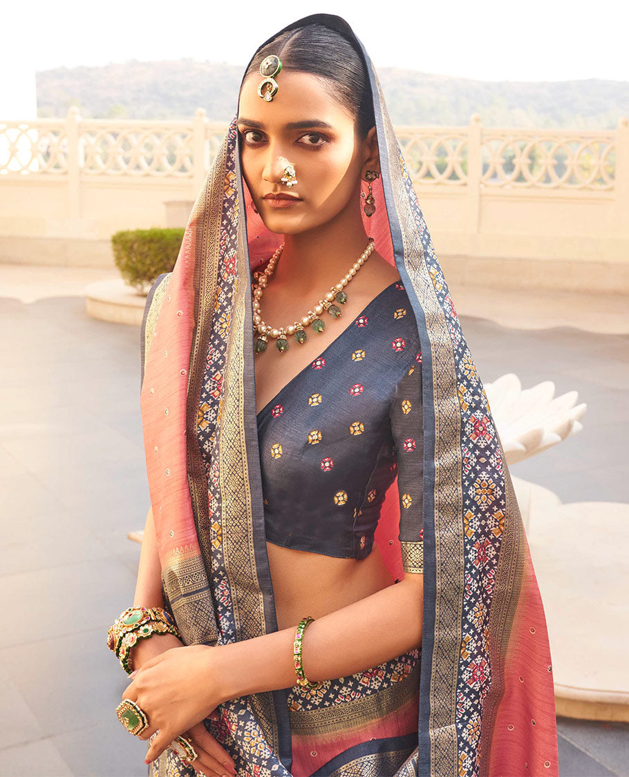 Peach Ikat Patola Designer Saree, Subtly Woven with Ikat Butta, Complemented by a Contrast Ikat Border, Intricate Pallu, and a Contrast Blouse