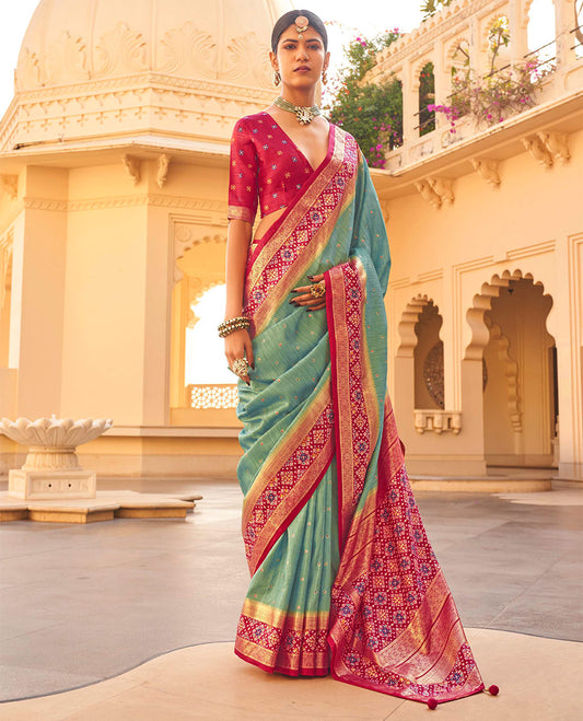 Rama Ikat Patola Designer Saree, Subtly Woven with Ikat Buttas, Complemented by a Contrast Ikat Border, Intricate Pallu, and a Contrast Blouse