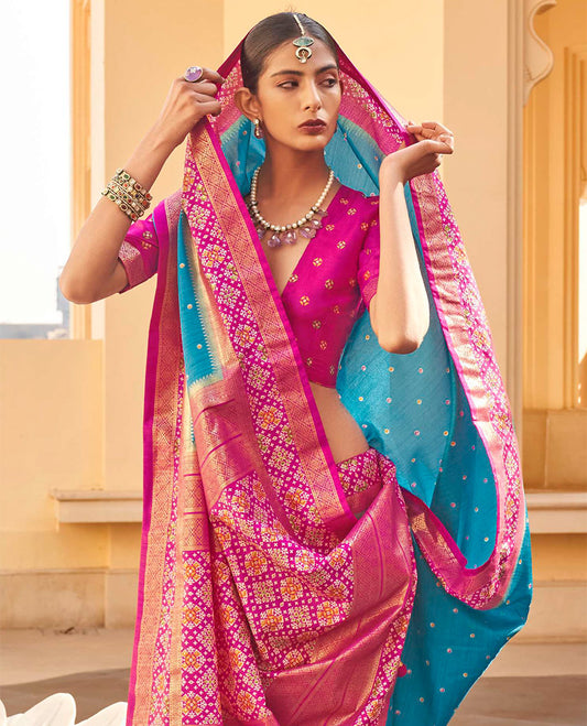 Blue Ikat Patola Designer Saree, Subtly Adorned with Ikat Buttas, Complemented by a Contrast Ikat Border, Intricate Pallu, and a Contrast Blouse