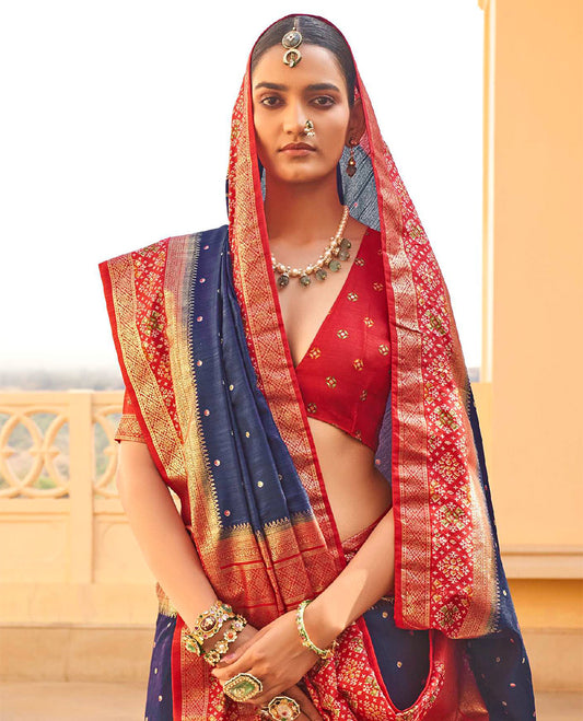 Navy Blue Ikat Patola Designer Saree, Subtly Adorned with Ikat Buttas, Complemented by a Contrast Ikat Border, Intricate Pallu, and a Contrast Blouse