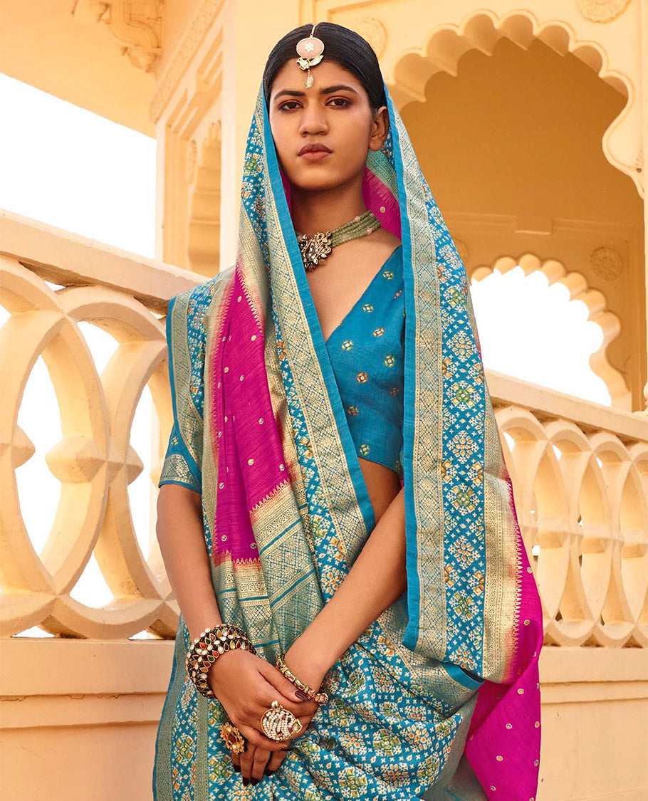 Rani Pink Ikat Patola Designer Saree, Subtly Adorned with Ikat Buttas, Complemented by a Contrast Ikat Border, Intricate Pallu, and a Contrast Blouse