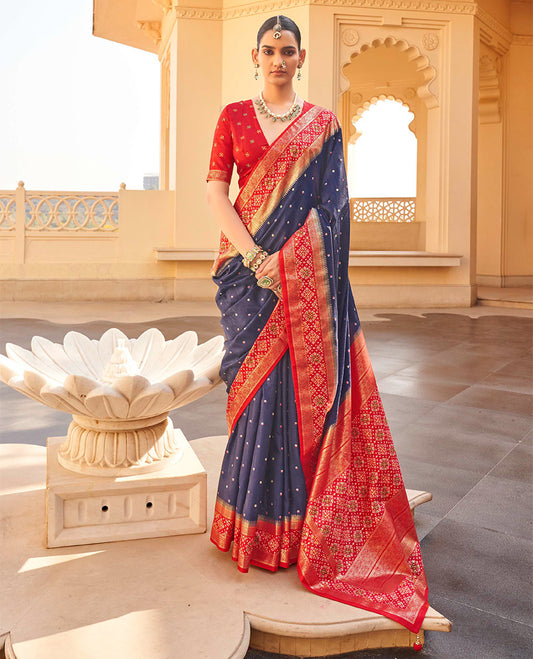 Navy Blue Ikat Patola Designer Saree, Subtly Adorned with Ikat Buttas, Complemented by a Contrast Ikat Border, Intricate Pallu, and a Contrast Blouse