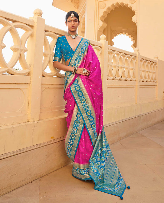 Rani Pink Ikat Patola Designer Saree, Subtly Adorned with Ikat Buttas, Complemented by a Contrast Ikat Border, Intricate Pallu, and a Contrast Blouse