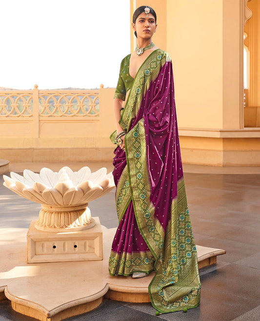 Purple Ikat Patola Designer Saree, Subtly Adorned with Ikat Buttas, Complemented by a Contrast Ikat Border, Intricate Pallu, and a Contrast Blouse