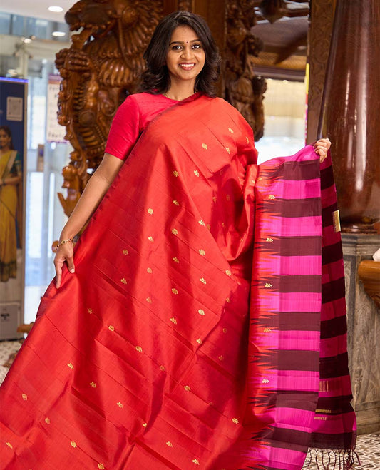 Red zari buttas Kanchipuram silk saree, contrast thazampoo rekku dual colored border of floral buttas, and zari woven pallu
