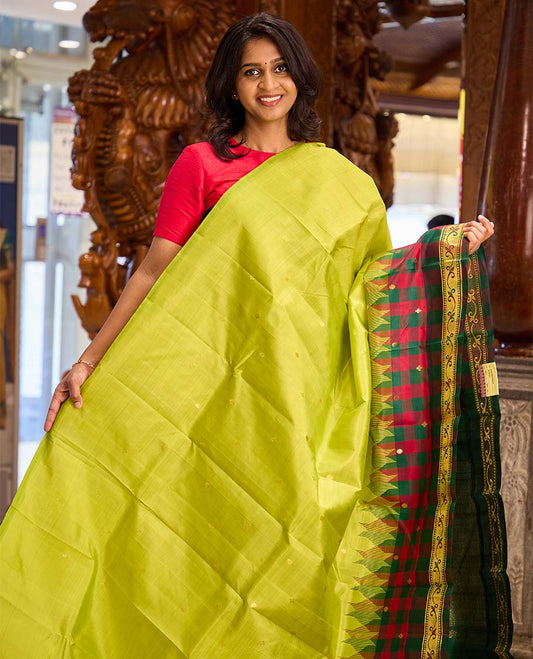 Parrot green zari buttas Kanchipuram silk saree, contrast one-sided checked border of thazampoo rekku, and kamalam designs, and zari design pallu