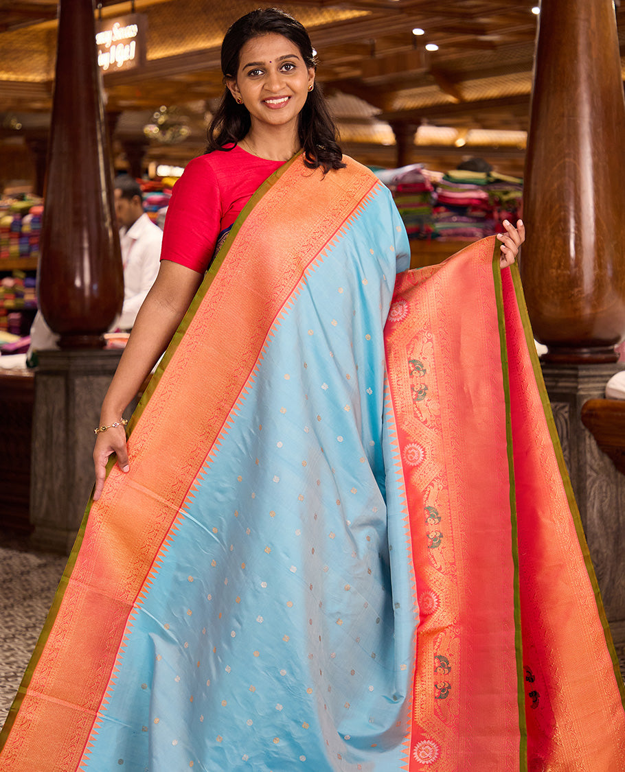 Baby blue mayil chakram buttas gadwal silk saree, contrast border of rekku, mayil, and kodi visiry designs, and intricate pallu