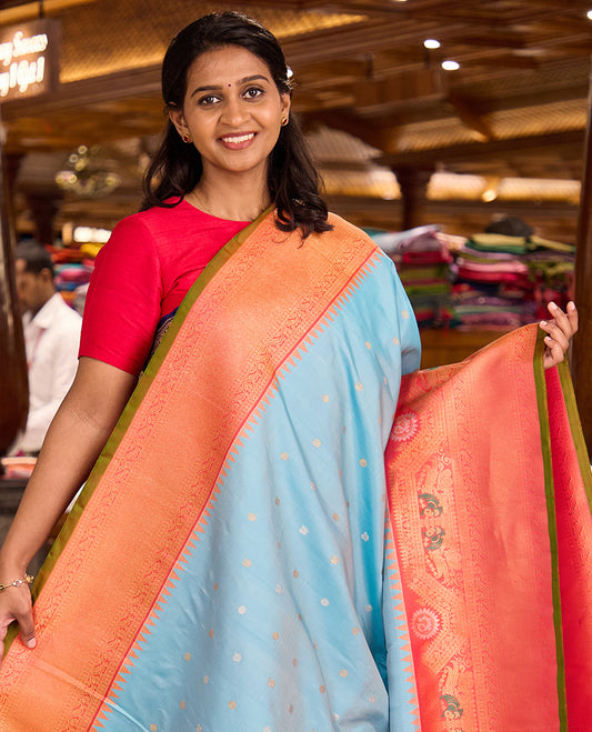 Baby blue mayil chakram buttas gadwal silk saree, contrast border of rekku, mayil, and kodi visiry designs, and intricate pallu