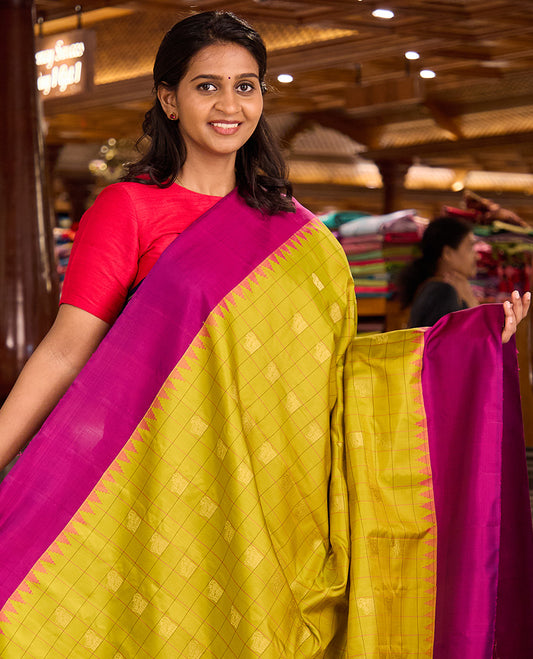Green buttas enclosed checked gadwal silk saree, contrast thazampoo rekku plain border, and pallu of mayil, and kuthirai designs