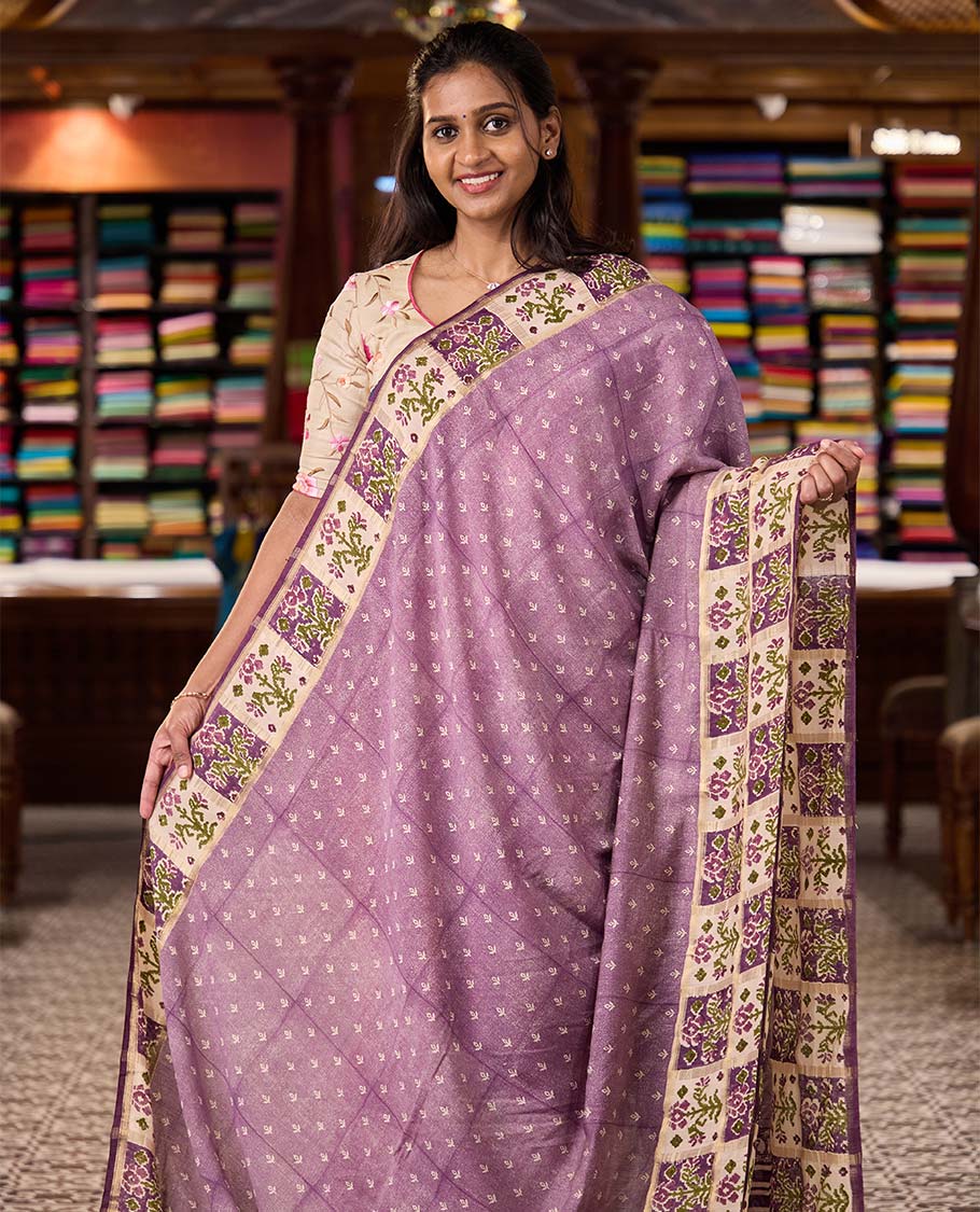 Lavender floral motifs hand block printed Muga silk saree, contrast Patola floral block printed border, and pallu of mango and stripes block print