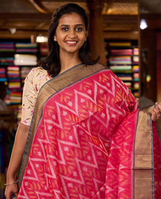 Pink Pochampally Ikkat-style chevron design silk cotton saree, contrast bavanji zari border, and ikkat design pallu