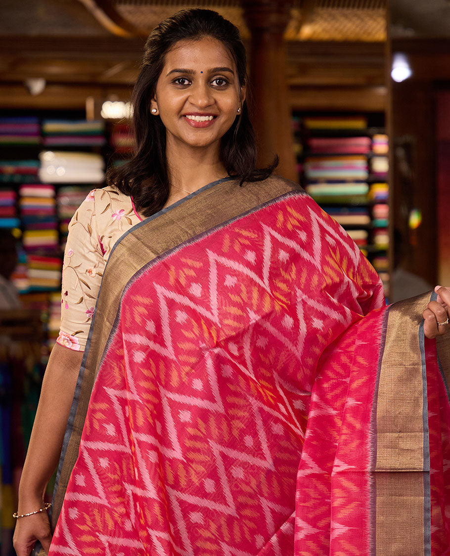 Pink Pochampally Ikkat-style chevron design silk cotton saree, contrast bavanji zari border, and ikkat design pallu