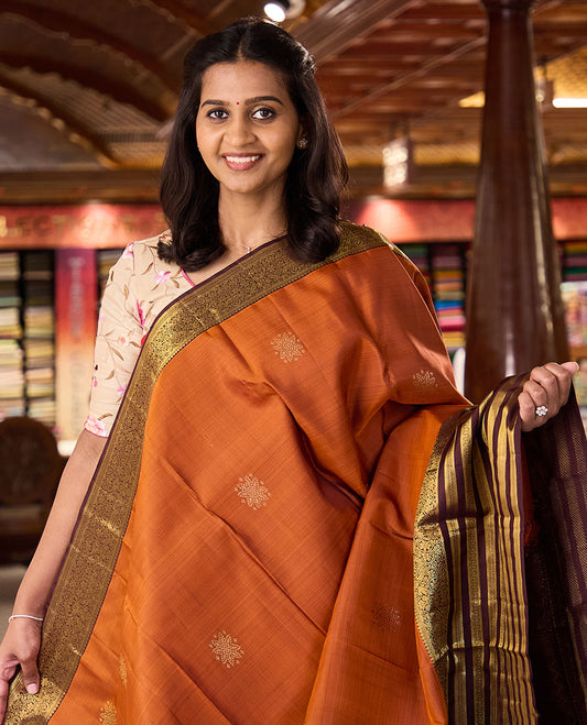 Orange zari buttas Kanchipuram silk saree, contrast varisai pettu border of thilakam mokku, banaras, muthu,  kodi visiry, and mayil designs, and jaal pallu