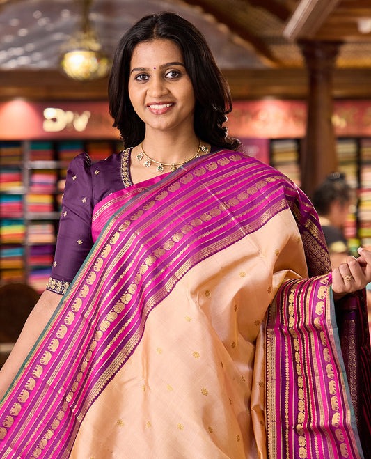 Sandal zari buttas Kanchipuram silksaree, contrast border of thilakam, muthu, laddu kamalam, mayil, and yaanai designs, and butta enclosed checked pallu