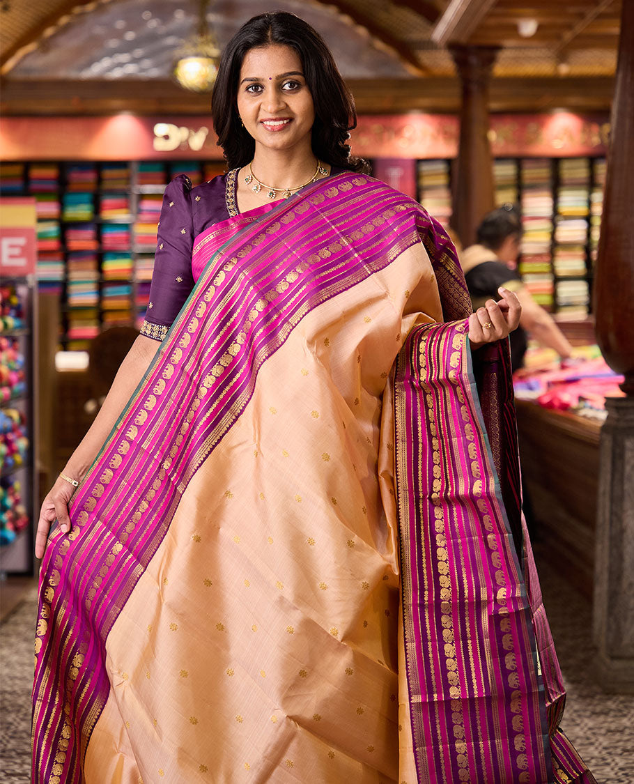 Sandal zari buttas Kanchipuram silksaree, contrast border of thilakam, muthu, laddu kamalam, mayil, and yaanai designs, and butta enclosed checked pallu