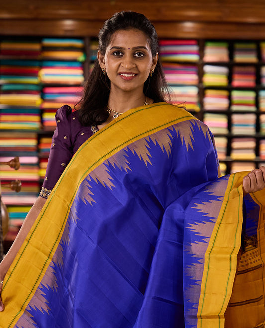Blue plain kanchipuram silk saree, contrast thazampoo rekku border of muthu, and kathir designs, and pallu of stripes, and thazampoo rekku designs