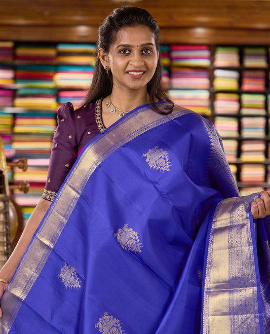 Royal blue zari buttas woven Kanchipuram silk saree, zari border of thilakam mokku, muthu, rudraksham, kodi visiry, chakram, and kathir designs, and jaal pallu