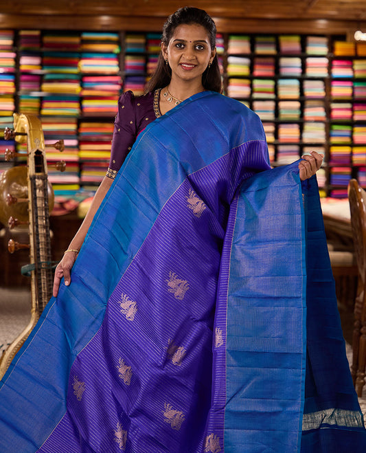 Blue zari buttas and striped kanchipuram silk saree, contrast zari vaira-oosai checked border, and zari design pallu