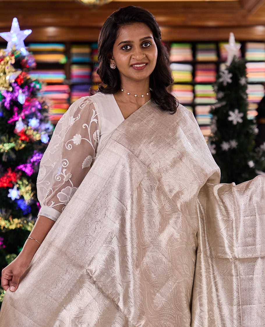 Pearl white Mughal-style ogee jacquard silk saree, traditional zari motifs sparsely woven border, and pallu