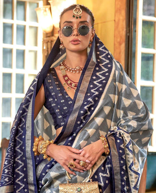 Grey triangle buttas patola designer catalog saree, contrast ikkat geometric border and pallu of ikkat jaal design