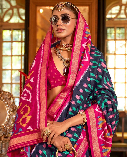 Navy blue ikkat buttas designer catalog saree, contrast chevron ikkat patterned border, pallu of ikkat design