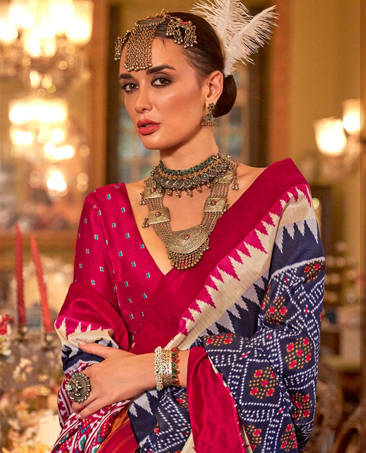 Ink blue diamond patterned patola designer catalog saree, contrast temple border, and patola design pallu