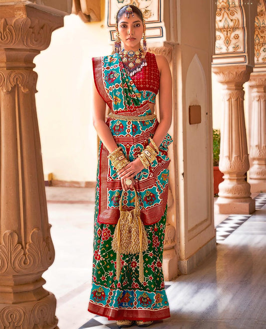 Green intricate patola patterned designer catalog saree, contrast border and pallu of patola designs