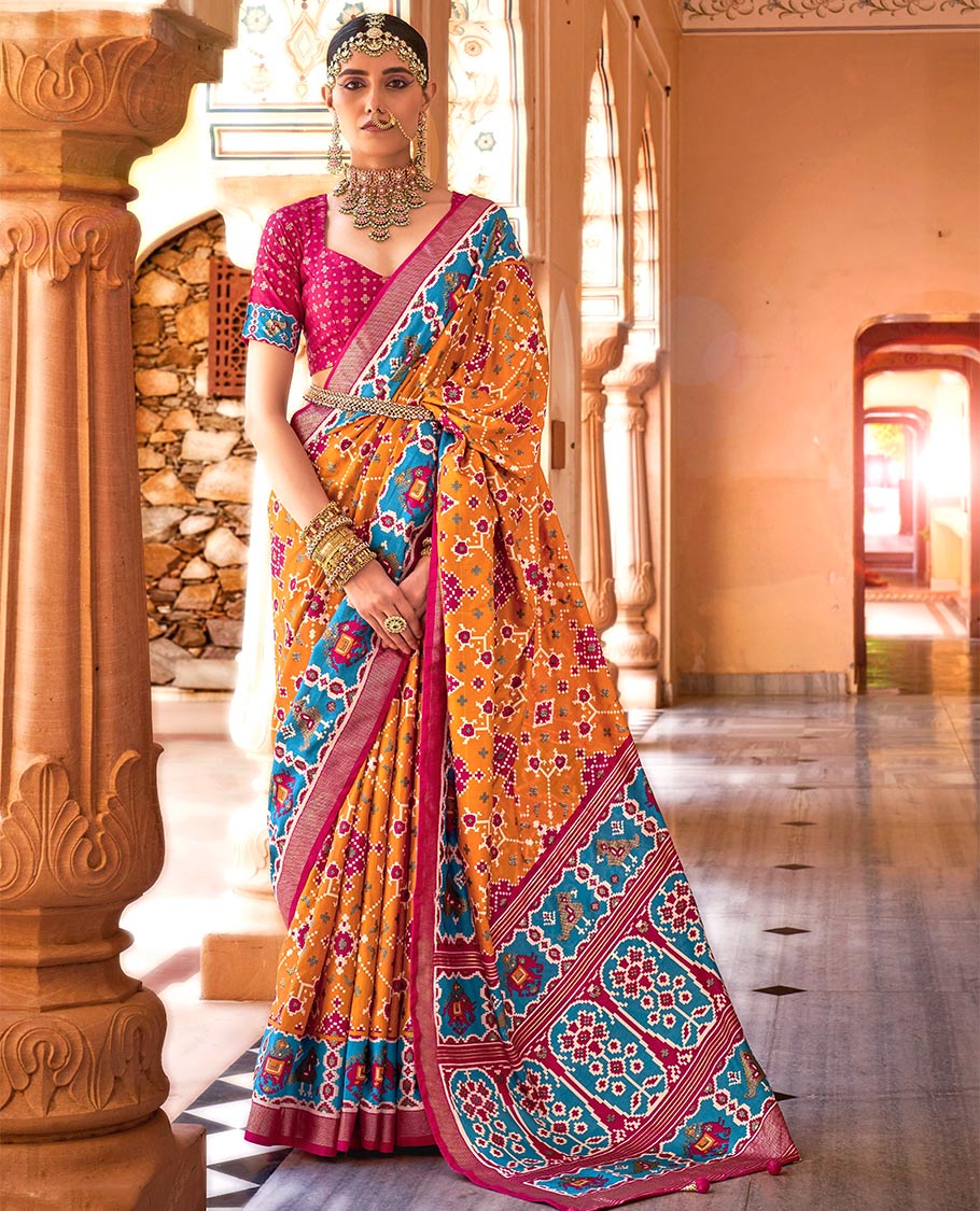 Orange intricate patola patterned designer catalog saree, contrast border and pallu of patola designs