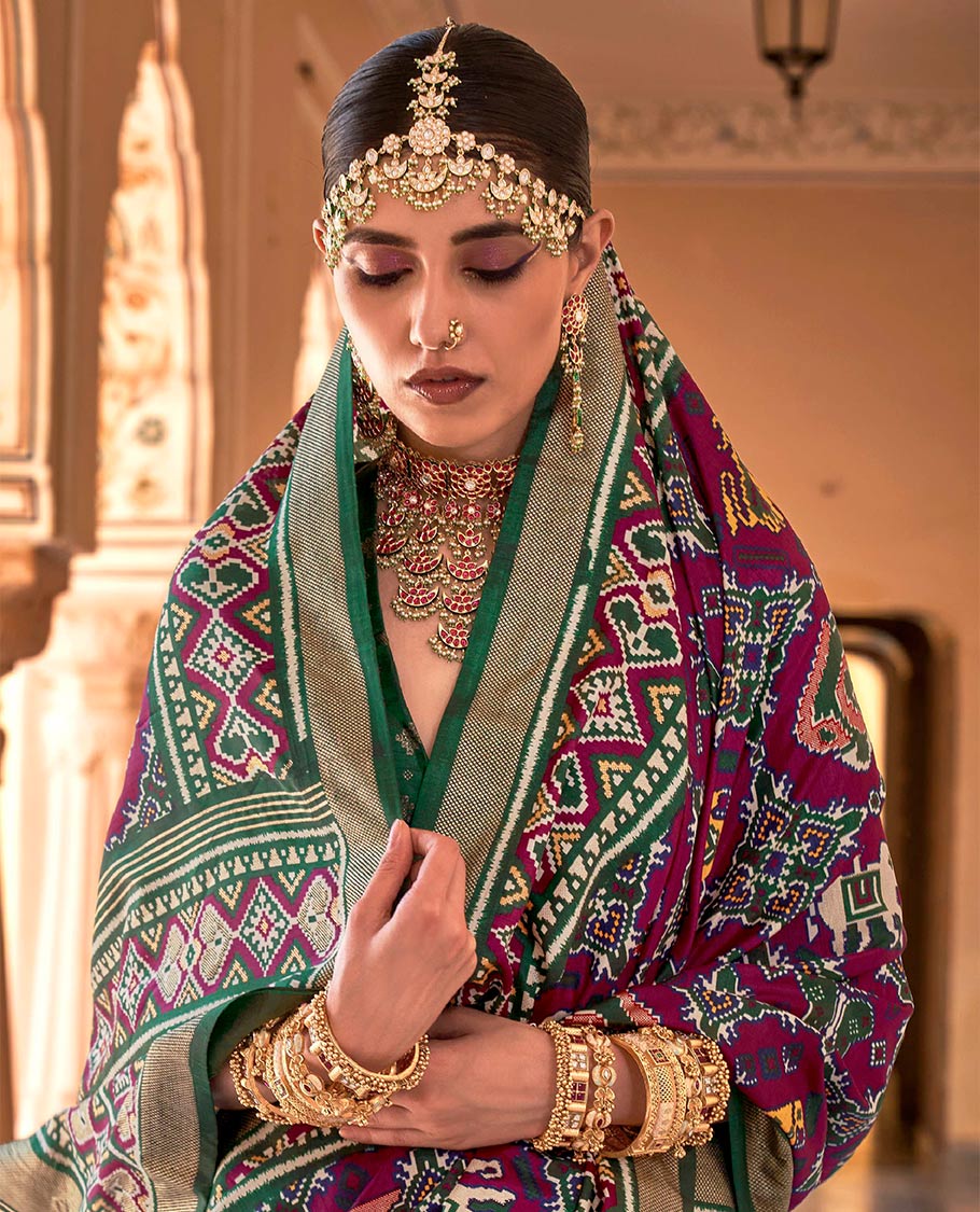 Purple buttas enclosed jaal patterned patola designer catalog saree, contrast border and pallu of patola designs