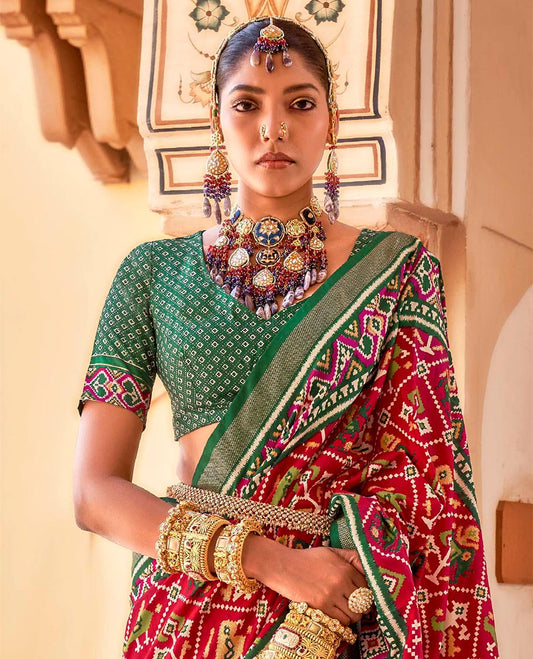 Red buttas enclosed jaal patterned patola designer catalog saree, contrast border and pallu of patola designs