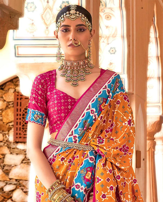 Orange intricate patola patterned designer catalog saree, contrast border and pallu of patola designs