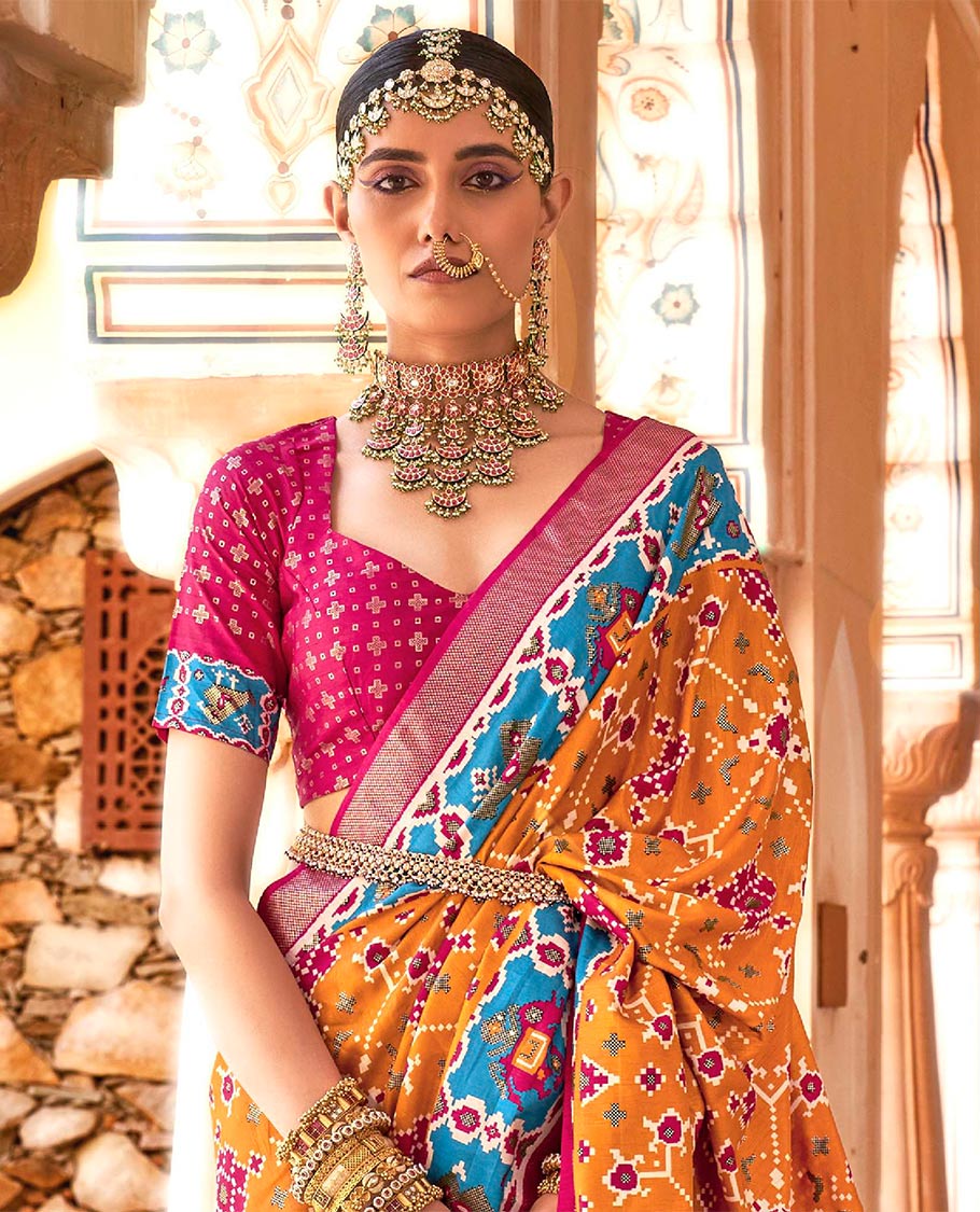 Orange intricate patola patterned designer catalog saree, contrast border and pallu of patola designs
