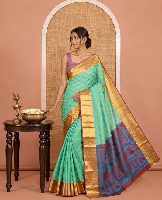 Parrot Green Semi-Organza Saree Features Pochampally Ikat Chevron Stripes, a Contrast Border, Paisley Pallu, and Contrast Blouse