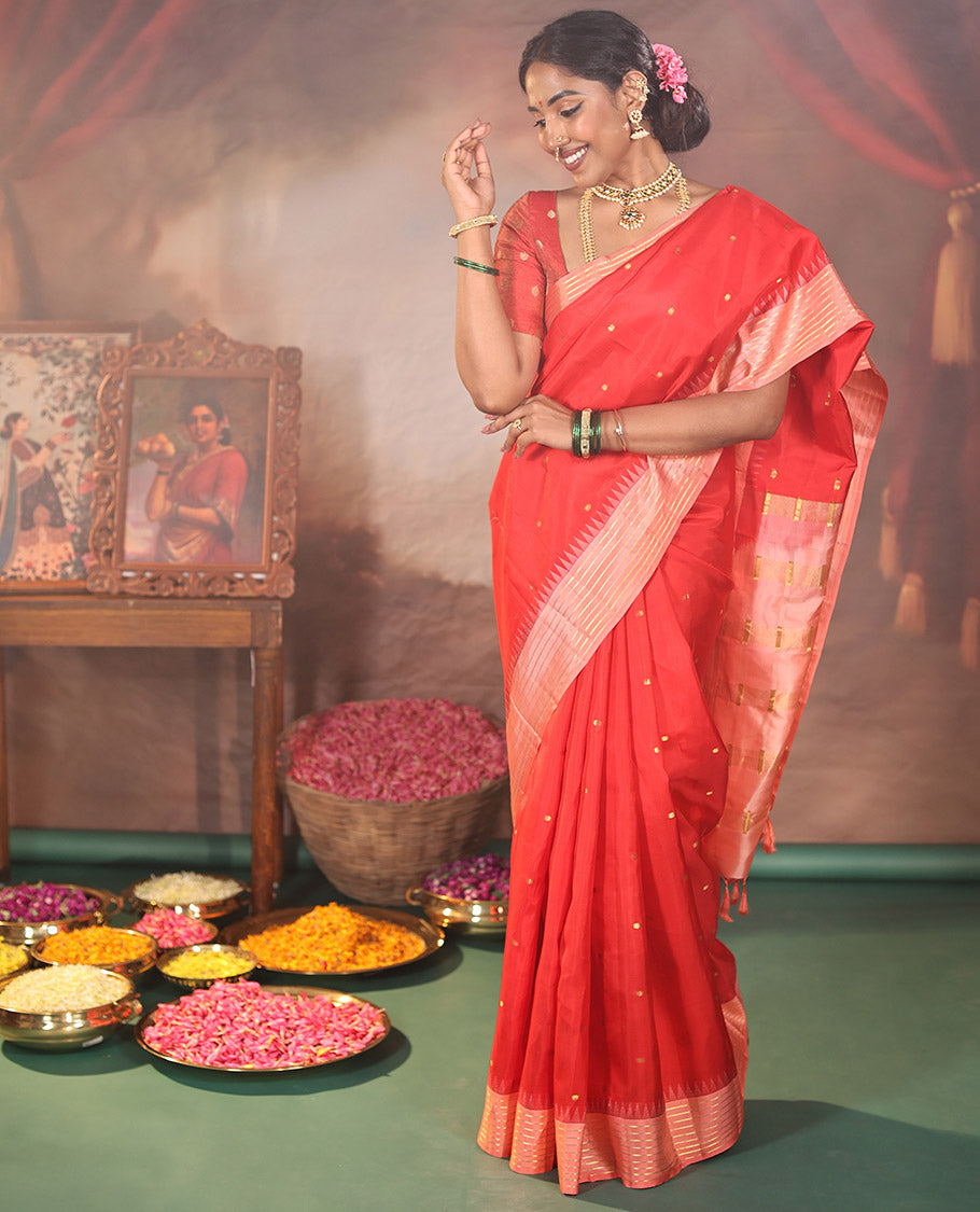 Red Vasundhara Silk Saree, Gracefully Woven with Kamalam Buttas on Its Body, Complemented by a Captivating Contrast Thazampoo Rekku Border of Banaras Designs, Zari-Decked Up Pallu, and Paired with a Contrast Blouse