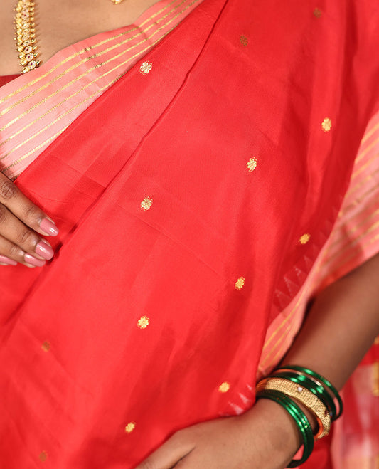 Red Vasundhara Silk Saree, Gracefully Woven with Kamalam Buttas on Its Body, Complemented by a Captivating Contrast Thazampoo Rekku Border of Banaras Designs, Zari-Decked Up Pallu, and Paired with a Contrast Blouse