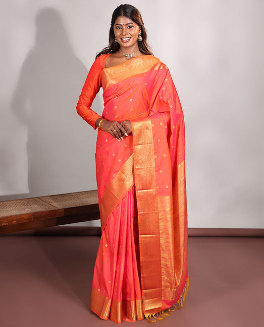Orange Budget Silk Saree, Meticulously Woven with Zari Buttas on Its Body, Highlighted by a Traditional Zari Design Woven Border, Intricately Designed Pallu, and Paired with a Matching Blouse