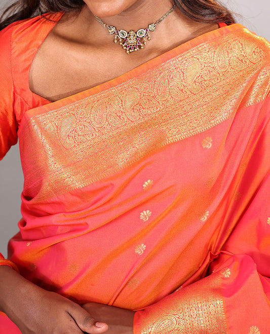 Orange Budget Silk Saree, Meticulously Woven with Zari Buttas on Its Body, Highlighted by a Traditional Zari Design Woven Border, Intricately Designed Pallu, and Paired with a Matching Blouse