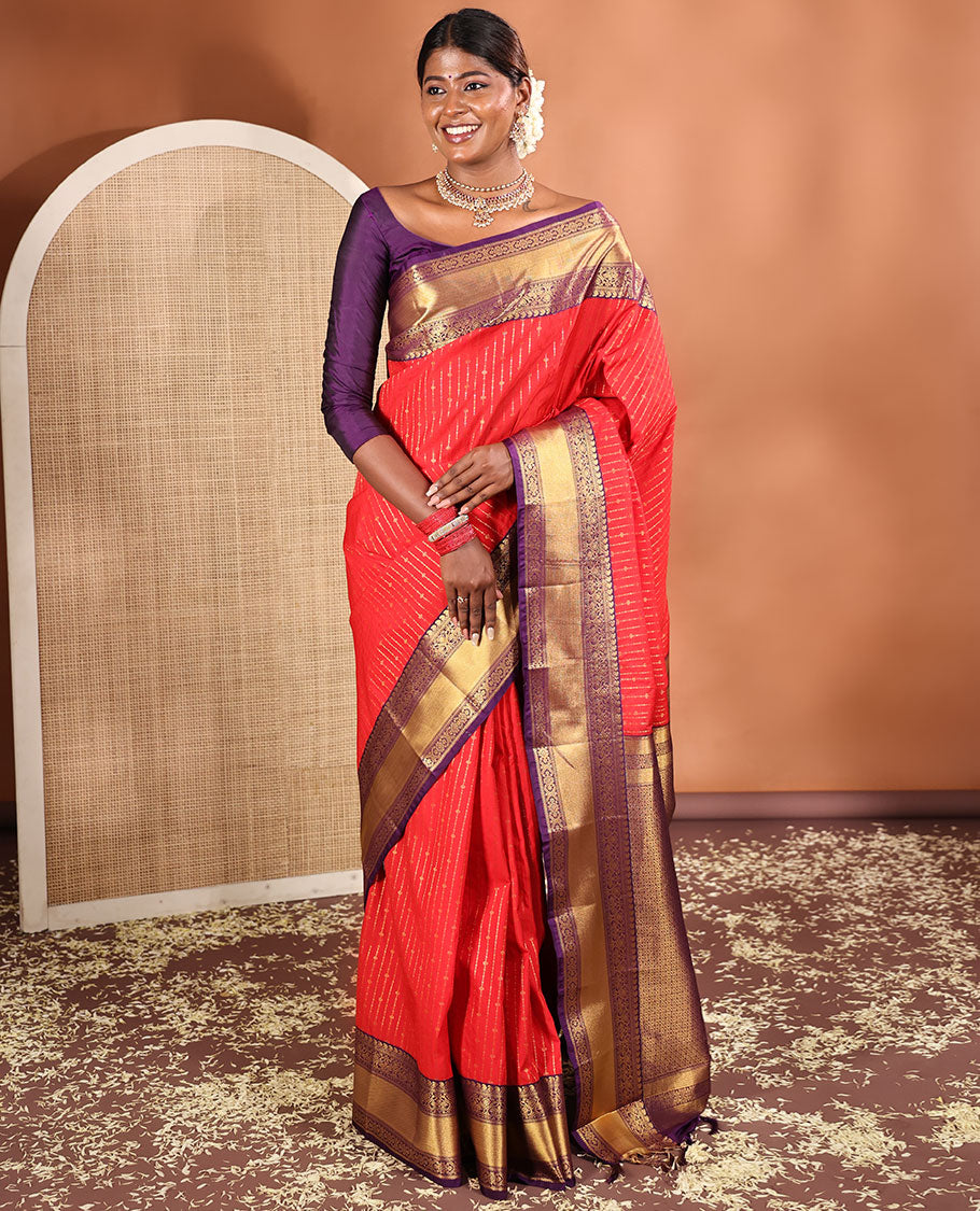 Red Budget Silk Saree, Embellished with Zari Stripes All Across Its Body, Complemented by Captivating Contrast Traditional Zari Designs Woven Border, Grandly Decked Up Jaal Patterned Pallu, and Paired with a Contrast Blouse
