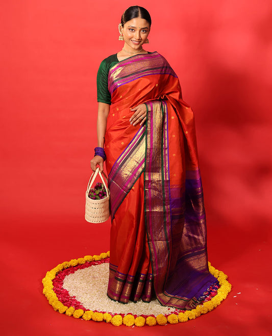 Orange zari buttas Kanchipuram silk saree, contrast border of manga mokku, banaras, kamalam, manga, rekku, mayil, and poun designs geometric patterned pallu