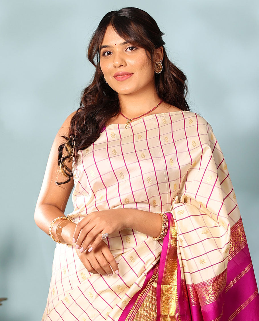 Cream kamalam zari buttas with checked Kanchipuram silk saree, contrast korvai border of thilakam mokku, banaras, and mayil kann designs, and zari design pallu
