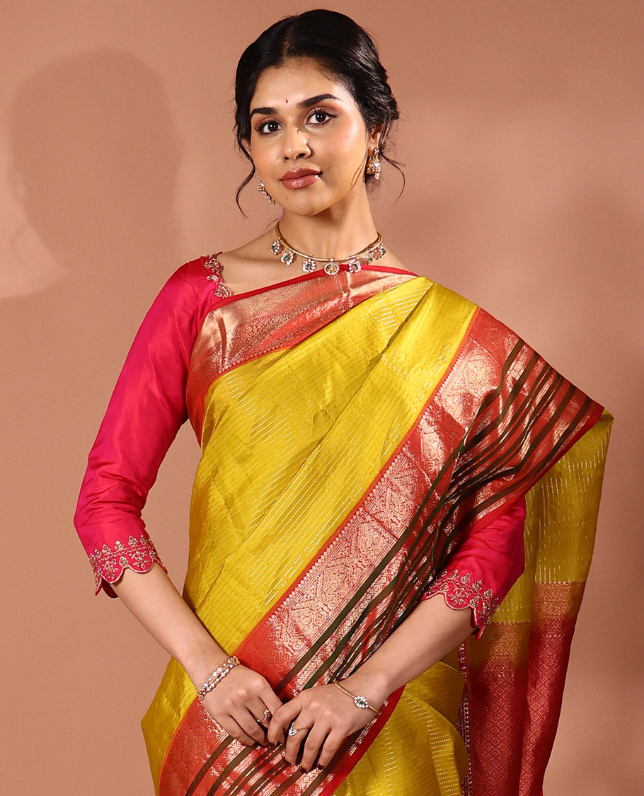 Yellow Muthu striped silk saree, contrast border of thilakam mokku, Muthu, banaras, mayil, kamalam, and neli designs, and intricate pallu