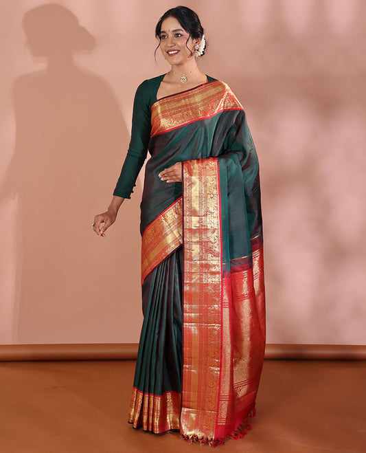Green Plain Kanchipuram Soft Silk Saree, Complemented by a Contrast Korvai Border of Thilakam Mokku, Mayil, Muthu, Neli, and Mayil Kann Designs, Zari Elevated Jaal Pallu, and Paired with a Contrast Blouse