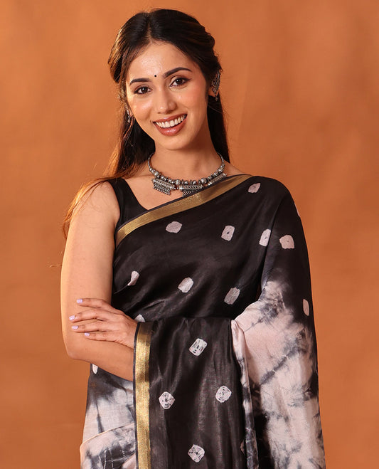Black and Cream Banana Pith Saree Elevated with Shibori Tie-Dye Print All Over Its Body, Subtle Piping Zari Border, Pallu Depicts Shibori Motifs Print, and Paired with a Matching Blouse