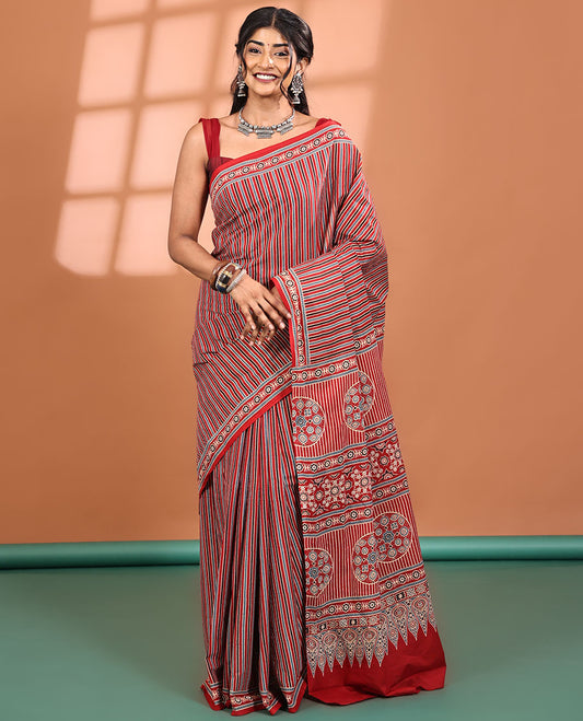Red-base Saree, Subtly Sparkled with Vertical Stripes All Across Its Body, Highlighted by Floral Ajrakh-style Printed Border, Ajrakh Printed Pallu, and Paired with a Matching Blouse