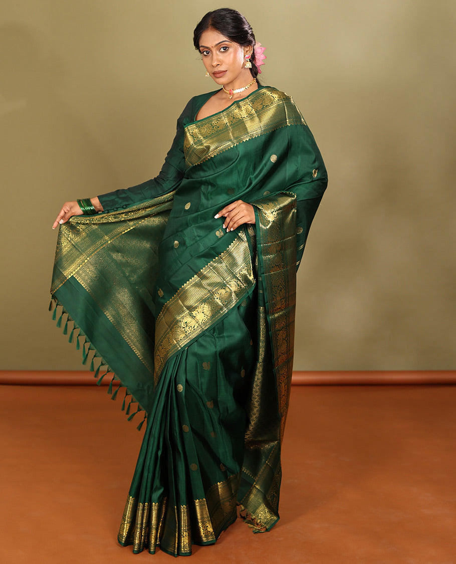 Green Kanchipuram Silk Saree, Elevated with Mayil-Chakram Buttas, a Zari Border of Rekku, Muthu, Mayil Kann, Banaras, Mayil, and Yaali Designs, Jaal Pallu, and a Matching Blouse