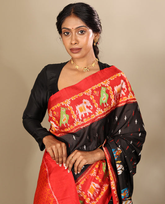 Black Pochampally Ikat Saree, Adorned with Buttas and Horse Rider Ikat Weave, a Contrast Ikat Animal Weave Border, Jaal Pallu, and a Contrast Blouse